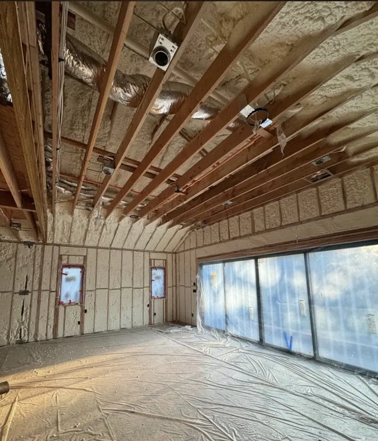 Interior walls and ceiling insulated with spray foam during new construction in Groveton